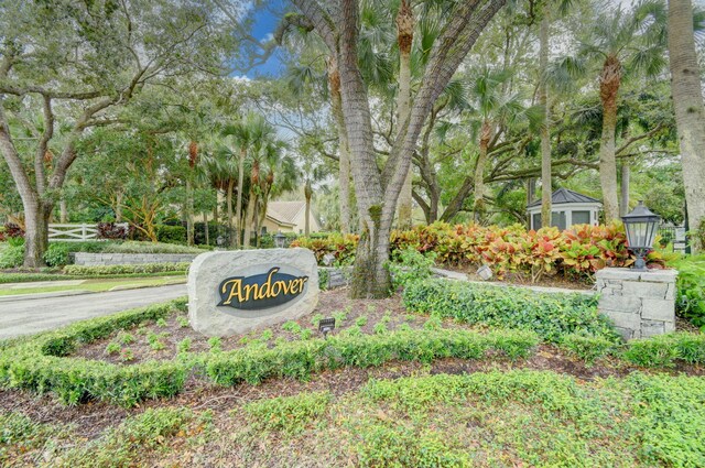 view of property's community featuring a playground, a yard, and a water view