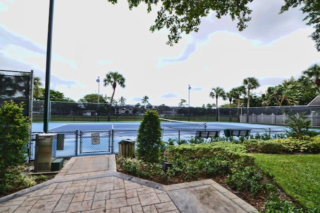 exterior space with tennis court