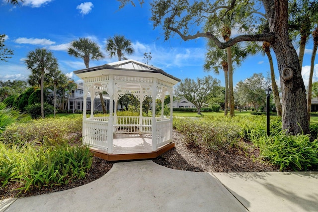 view of property's community featuring a gazebo and a wooden deck