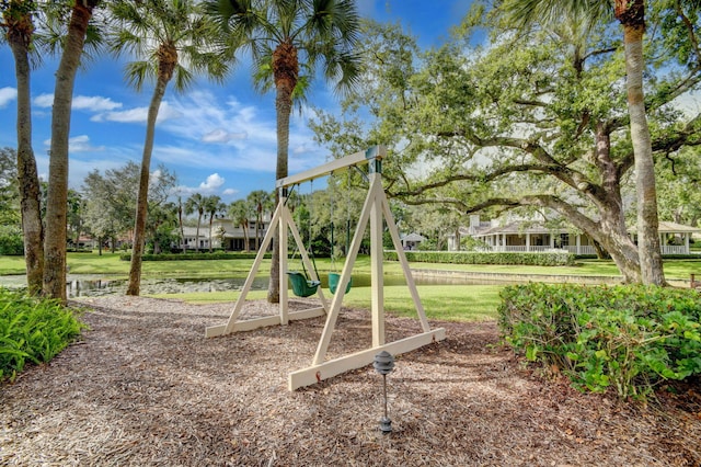 view of jungle gym featuring a lawn