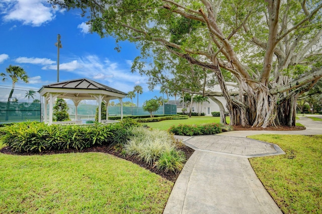 view of property's community featuring a gazebo and a lawn