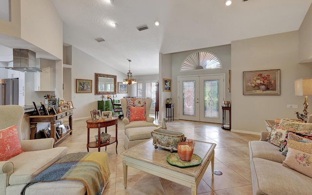 living room featuring light tile patterned flooring, french doors, a chandelier, and high vaulted ceiling