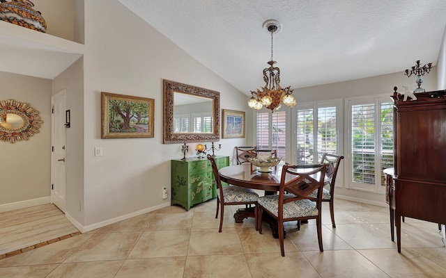 dining space featuring an inviting chandelier, a textured ceiling, light tile patterned floors, and vaulted ceiling