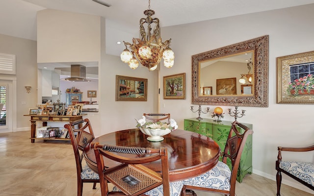 tiled dining room with an inviting chandelier and lofted ceiling