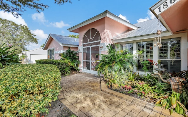 exterior space featuring a sunroom and a patio area