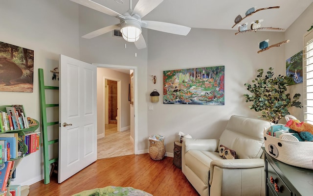 sitting room with hardwood / wood-style flooring and ceiling fan