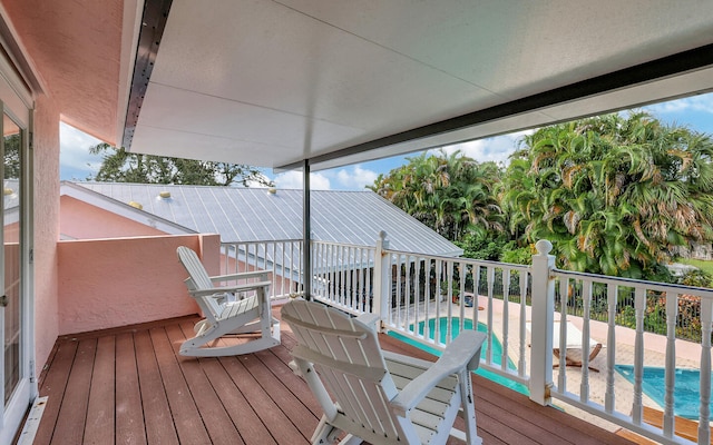 deck with a fenced in pool