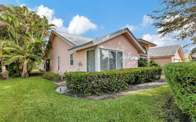 view of property exterior featuring a yard