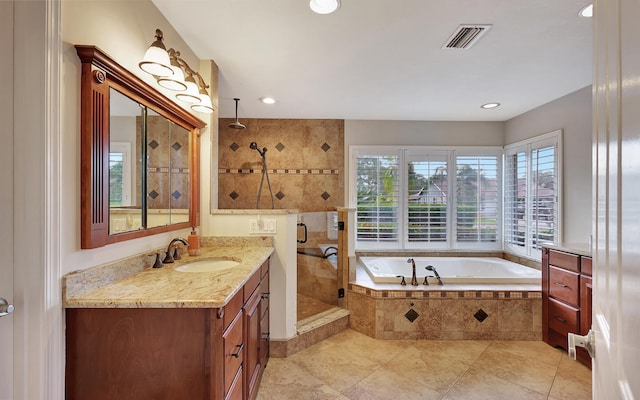 bathroom with vanity, shower with separate bathtub, and tile patterned flooring