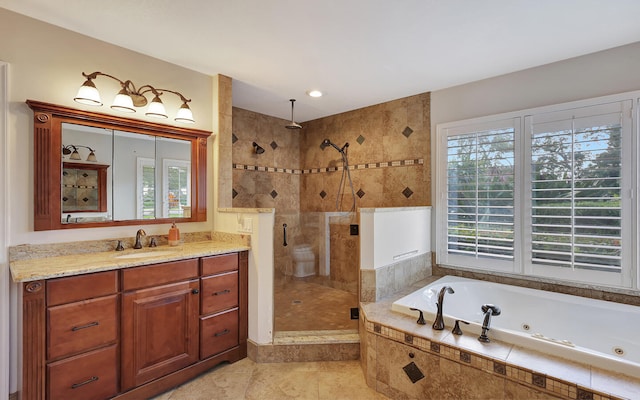 bathroom with vanity and separate shower and tub