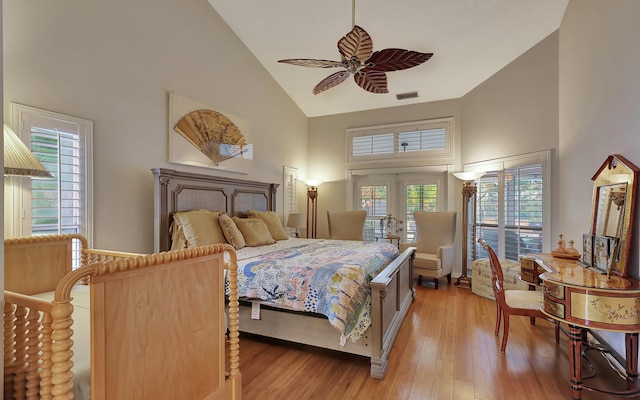 bedroom with french doors, ceiling fan, high vaulted ceiling, and light hardwood / wood-style flooring