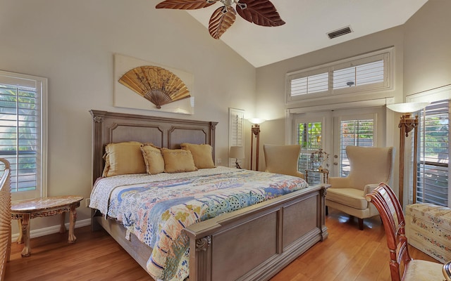 bedroom with french doors, access to exterior, ceiling fan, high vaulted ceiling, and light hardwood / wood-style flooring