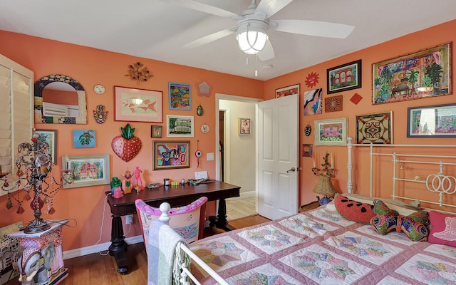 bedroom featuring hardwood / wood-style flooring and ceiling fan