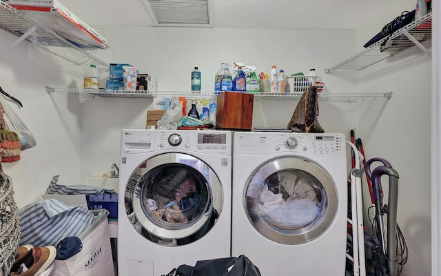 laundry room featuring washing machine and dryer