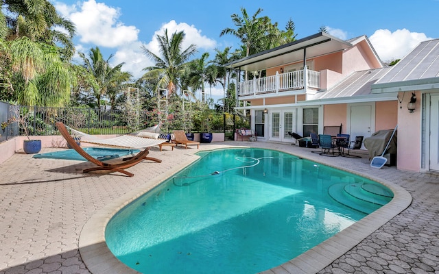 view of swimming pool featuring a patio