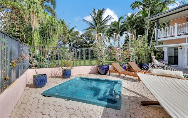 view of swimming pool featuring a patio area