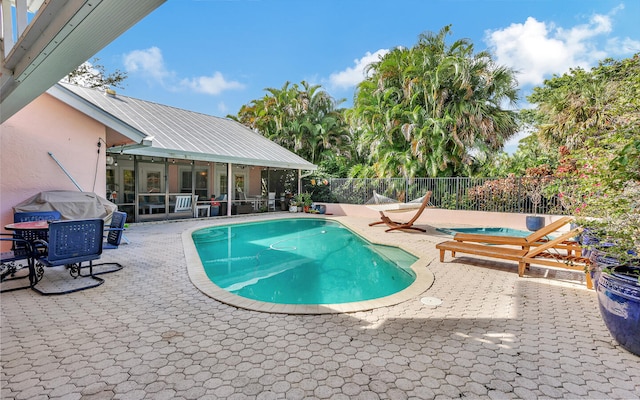 view of swimming pool with a patio