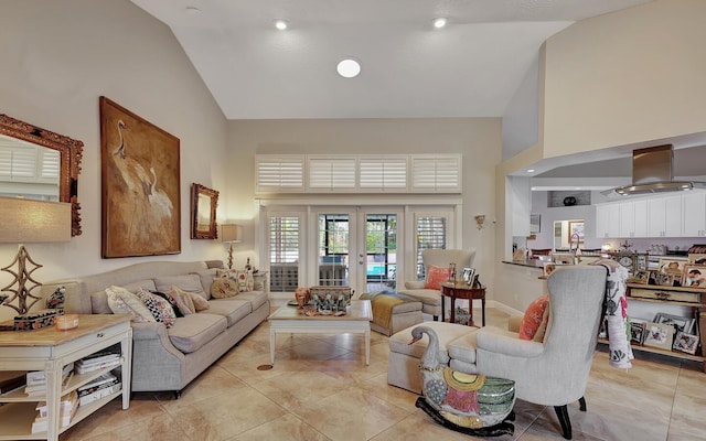 tiled living room with french doors and high vaulted ceiling