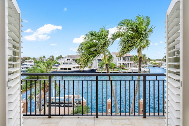 balcony featuring a water view