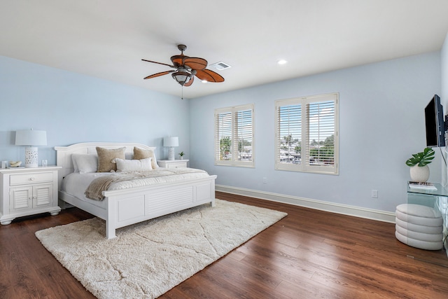 bedroom featuring ceiling fan and dark hardwood / wood-style flooring