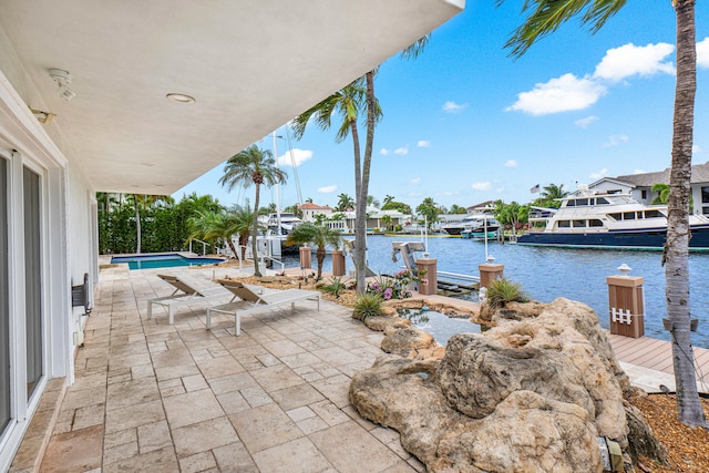 view of patio featuring a dock and a water view