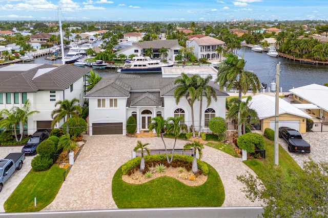 birds eye view of property featuring a water view