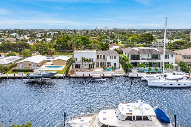 birds eye view of property featuring a water view