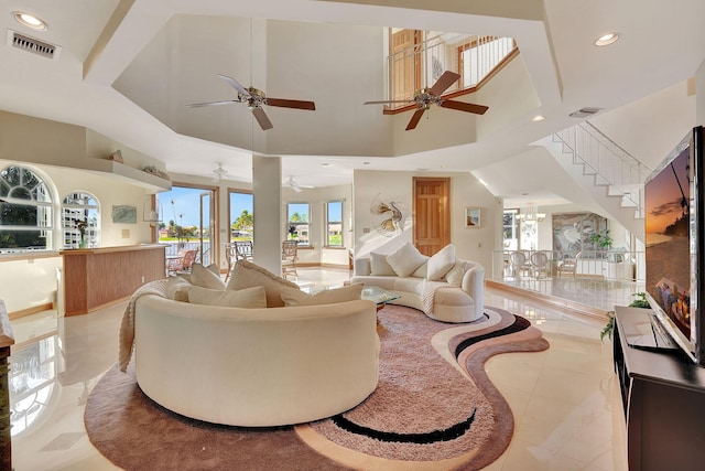 living room featuring a towering ceiling