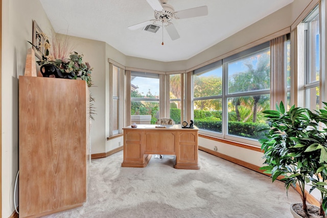 home office with ceiling fan and light colored carpet