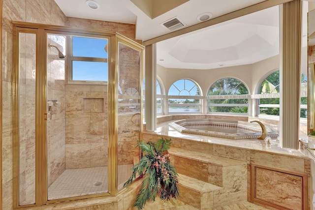 bathroom with a tray ceiling