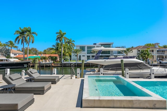 view of pool with a dock and a water view