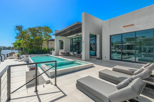 view of swimming pool with a patio area and ceiling fan