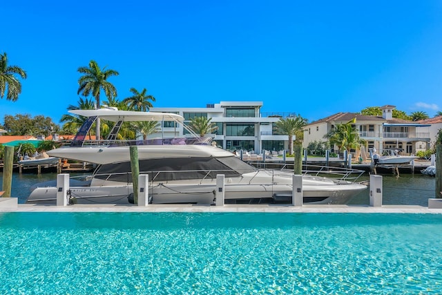 view of swimming pool featuring a water view