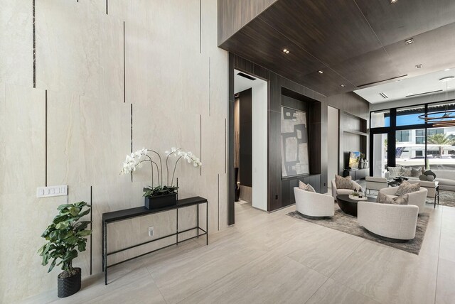 bedroom featuring ceiling fan, light hardwood / wood-style floors, and access to exterior