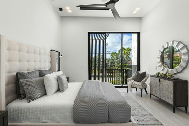 bedroom with access to outside and ceiling fan