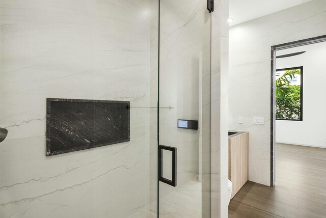 bathroom featuring vanity, tasteful backsplash, and plenty of natural light