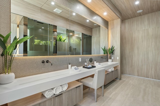 bathroom with backsplash and vanity