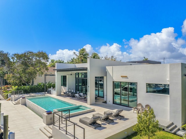 back of property with a patio and outdoor lounge area