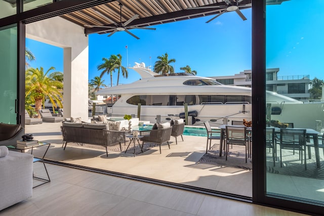 view of patio featuring an outdoor living space and ceiling fan