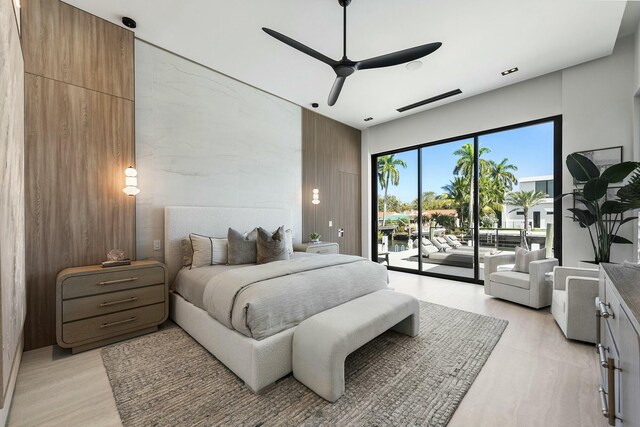 bedroom with access to exterior and ceiling fan