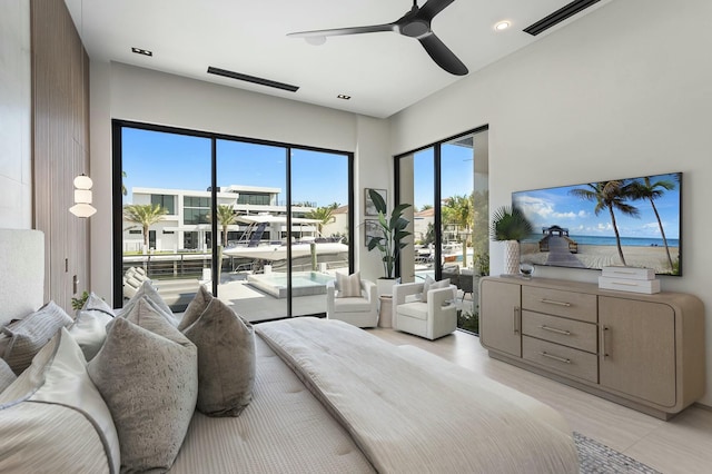 bedroom with ceiling fan and access to outside