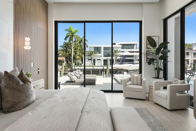 bedroom with multiple windows and access to exterior