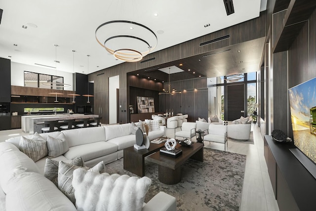 living room featuring expansive windows and a towering ceiling