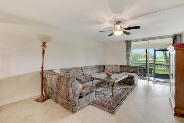 living room featuring ceiling fan and light tile patterned floors