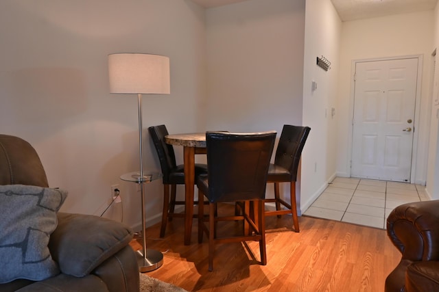 dining space with light wood-type flooring