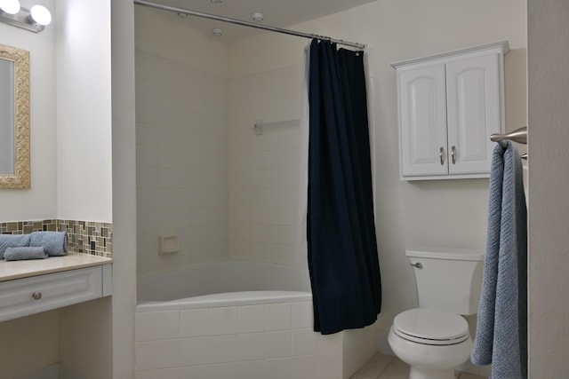 bathroom featuring shower / bath combo with shower curtain and toilet