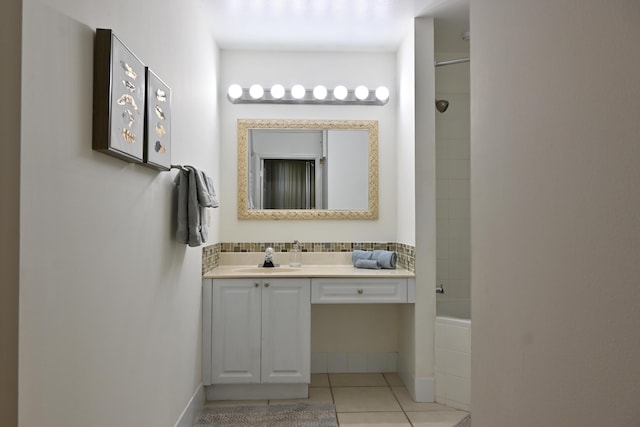 bathroom with tub / shower combination, vanity, and tile patterned flooring