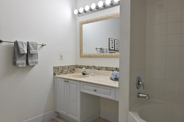 bathroom featuring vanity and tiled shower / bath combo