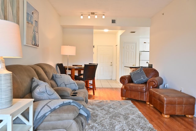 living room with light hardwood / wood-style flooring