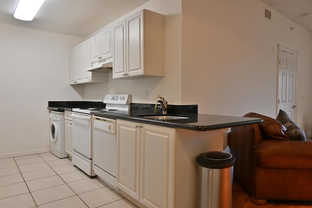 kitchen with white dishwasher, white cabinets, sink, electric range, and washer / dryer